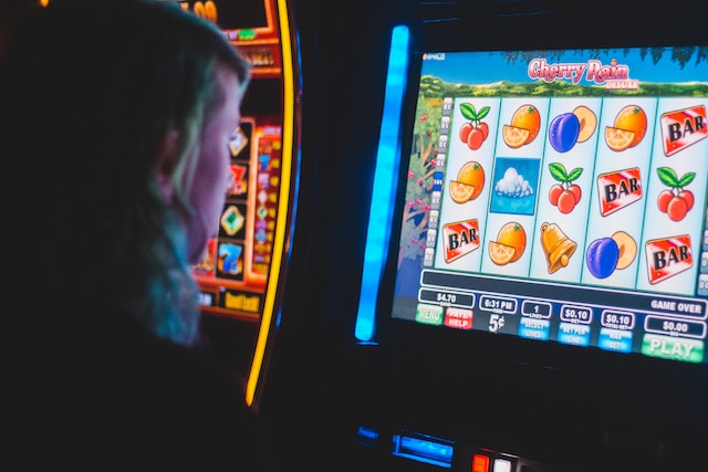 Man playing a slot machine